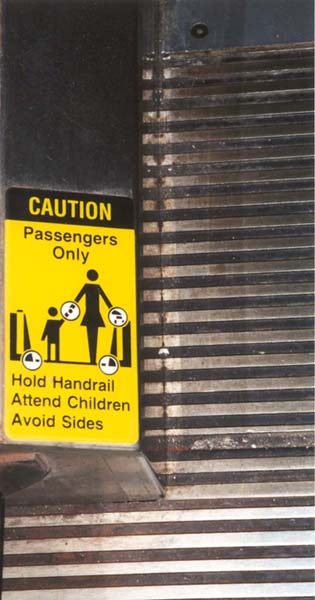 Hold Children. Avoid accidents. Love handrails. Avoid children. Hand over rails. Avoid handrails. Hand over children. A side of children, hold the love. Yellow and black passengers only.